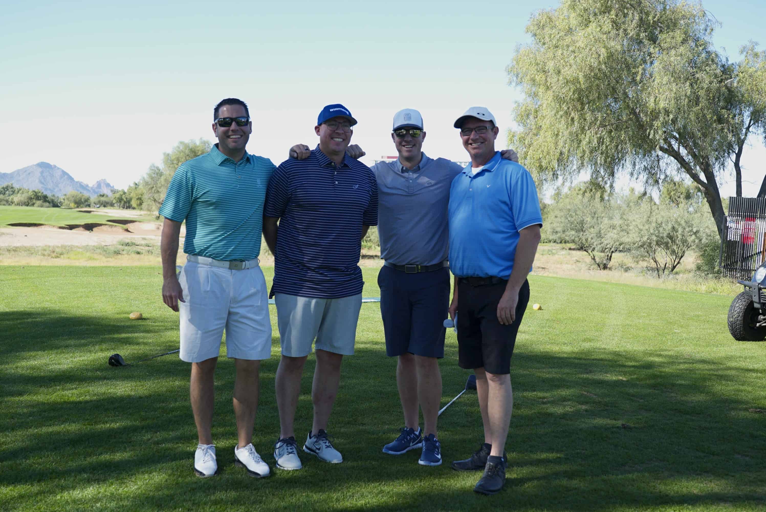 Four men posing for a photo at the 2018 NAIOP Golf Tournament.