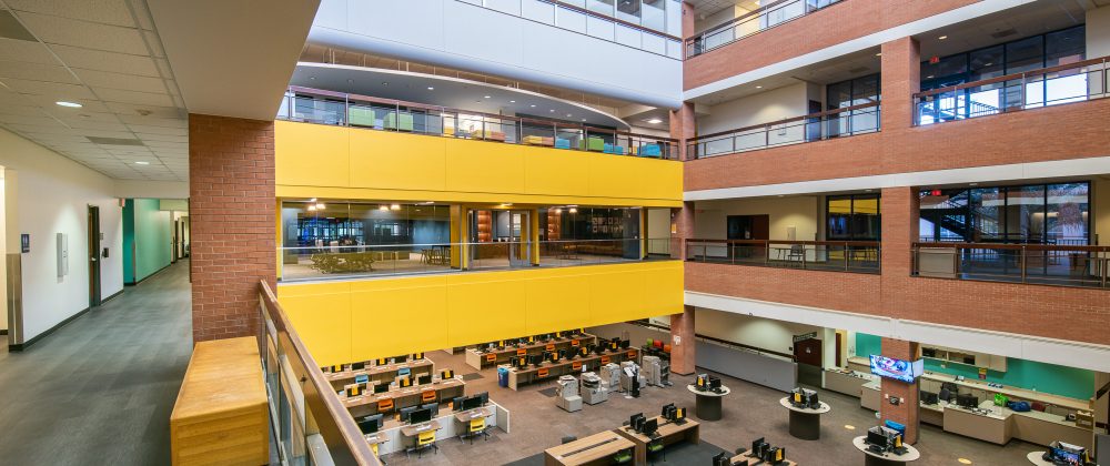 ASU Dreamscape is a large building with a lot of desks and tables.